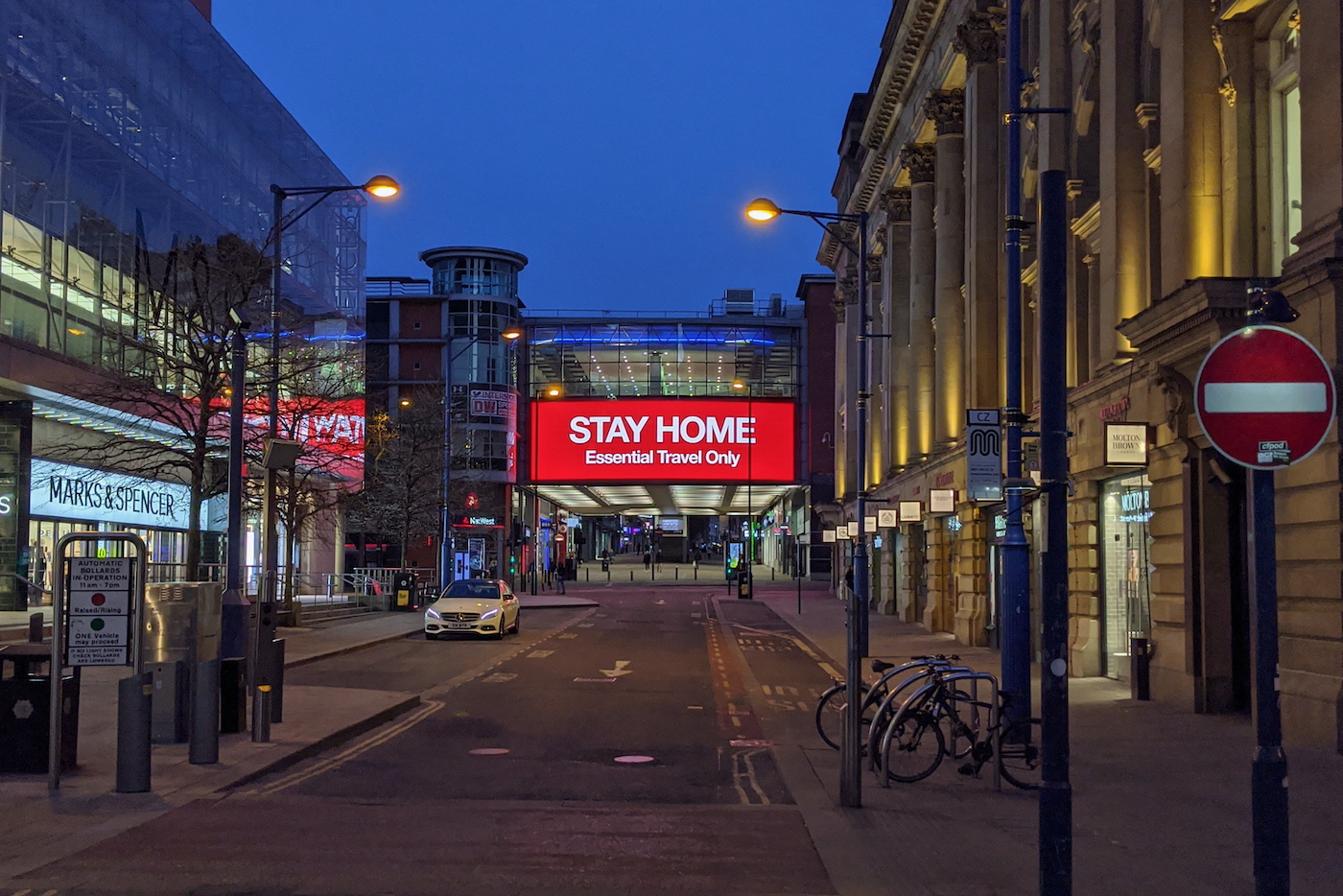 Sign in Manchester city centre displaying 'Stay Home'